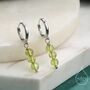 Sterling Silver Genuine Peridot Trio Huggie Hoop Earrings, thumbnail 1 of 10