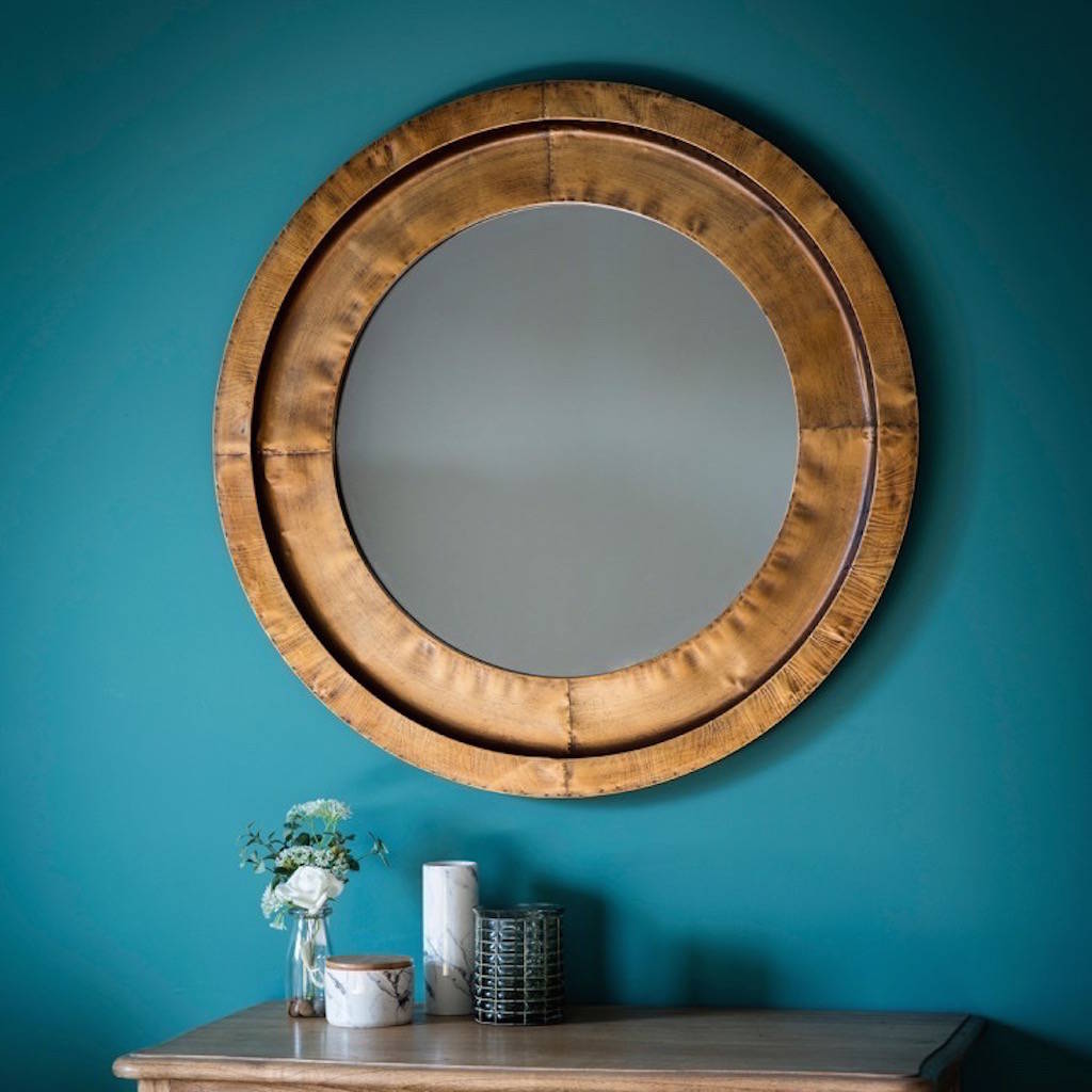 soft metal bronzed round mirror by the forest & co