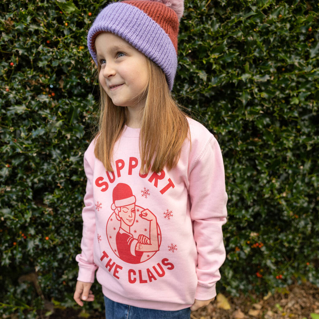 Support The Claus Girls' Christmas Jumper, 1 of 4