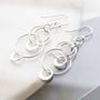 Sterling Silver Swinging Circles Dangly Earrings, thumbnail 1 of 4