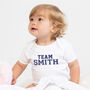 'Team Surname' Personalised Baby Grow, thumbnail 1 of 5