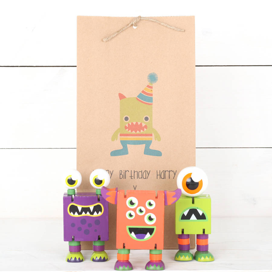 Three Wooden Monsters And Personalised Gift Bag By Red Berry Apple