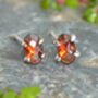 Oval Garnet Stud Earrings In Sterling Silver, thumbnail 1 of 3