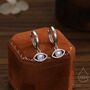 Sterling Silver Moonstone Evil Eye Huggie Hoop Earrings, thumbnail 1 of 10