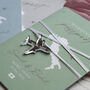 Sage Green Passport Invitation With Acrylic Plane Charms For Destination Wedding, thumbnail 2 of 10