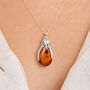 Sterling Silver Baltic Amber Penguin Necklace, thumbnail 1 of 11