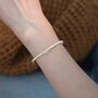 Saskia Ivory Silver Pearl Ribbon Ball Charm Gift Bracelet, thumbnail 1 of 6