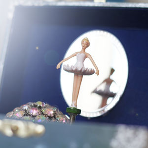 musical jewellery box with dancing doll on it