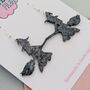 Black Glitter Witch On A Broom Halloween Resin Earrings, thumbnail 2 of 4