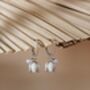 White Enamel Lily And Pearl Huggie Hoop Earrings, thumbnail 5 of 7