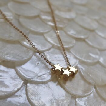 Tiny Gold Star Necklace, 2 of 11