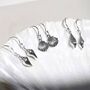 Sterling Silver Spiral Shell Dangly Earrings, thumbnail 5 of 7