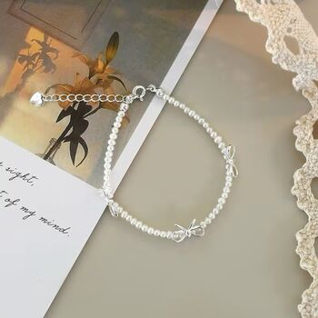 Saskia Ivory Silver Pearl Ribbon Ball Charm Gift Bracelet, 5 of 6