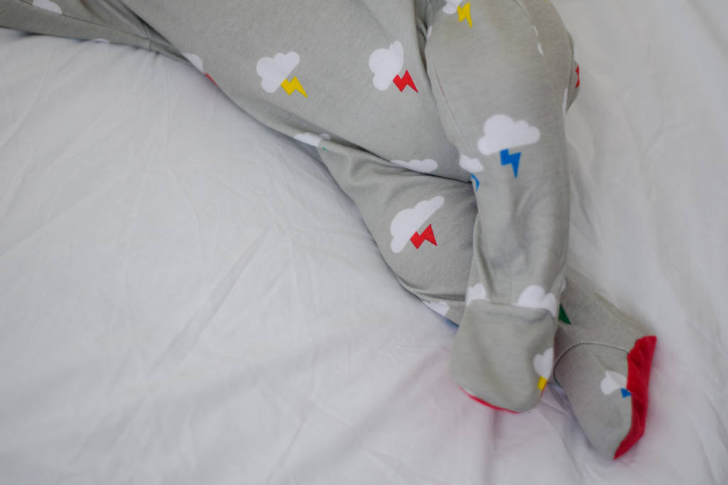 Grey Clouds And Bolts Baby Sleepsuit By Lil' Cubs | notonthehighstreet.com