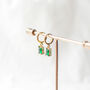 Emerald Green Huggie Earrings, thumbnail 3 of 9