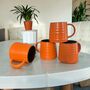 Set Of Four Reactive Glaze Brûlée Mugs In Pumpkin Orange And Brown, thumbnail 1 of 3
