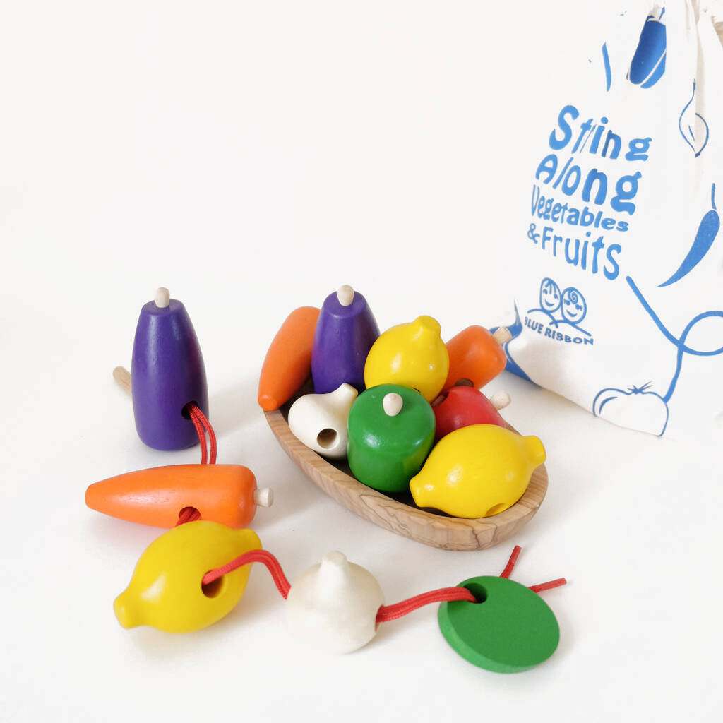 Image of Wooden Vegetables With Thread Wooden Needle