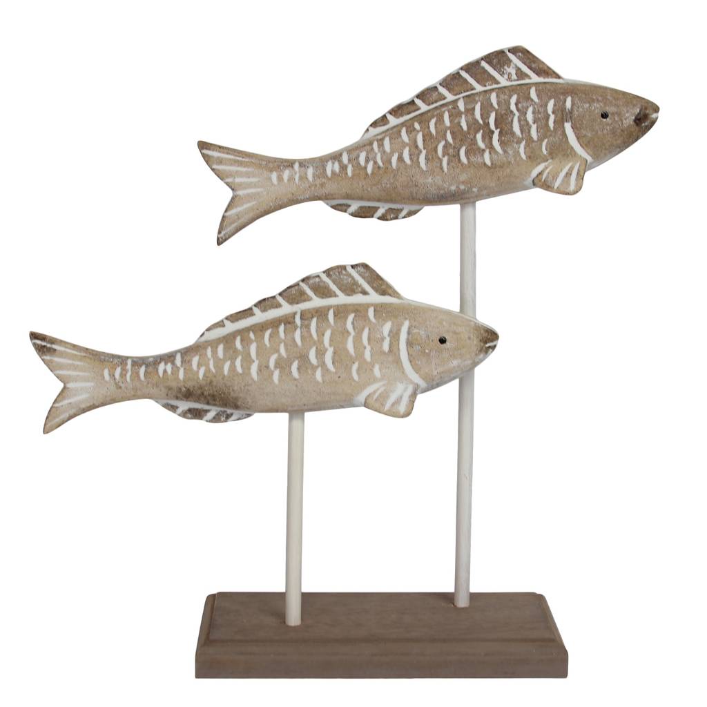 carved wooden fish by the nautical home