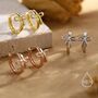 Sterling Silver Dainty Ribbon Bow Huggie Hoop Earrings, thumbnail 1 of 11