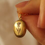 Tiny Thistle Oval Personalised Locket Necklace, thumbnail 1 of 10