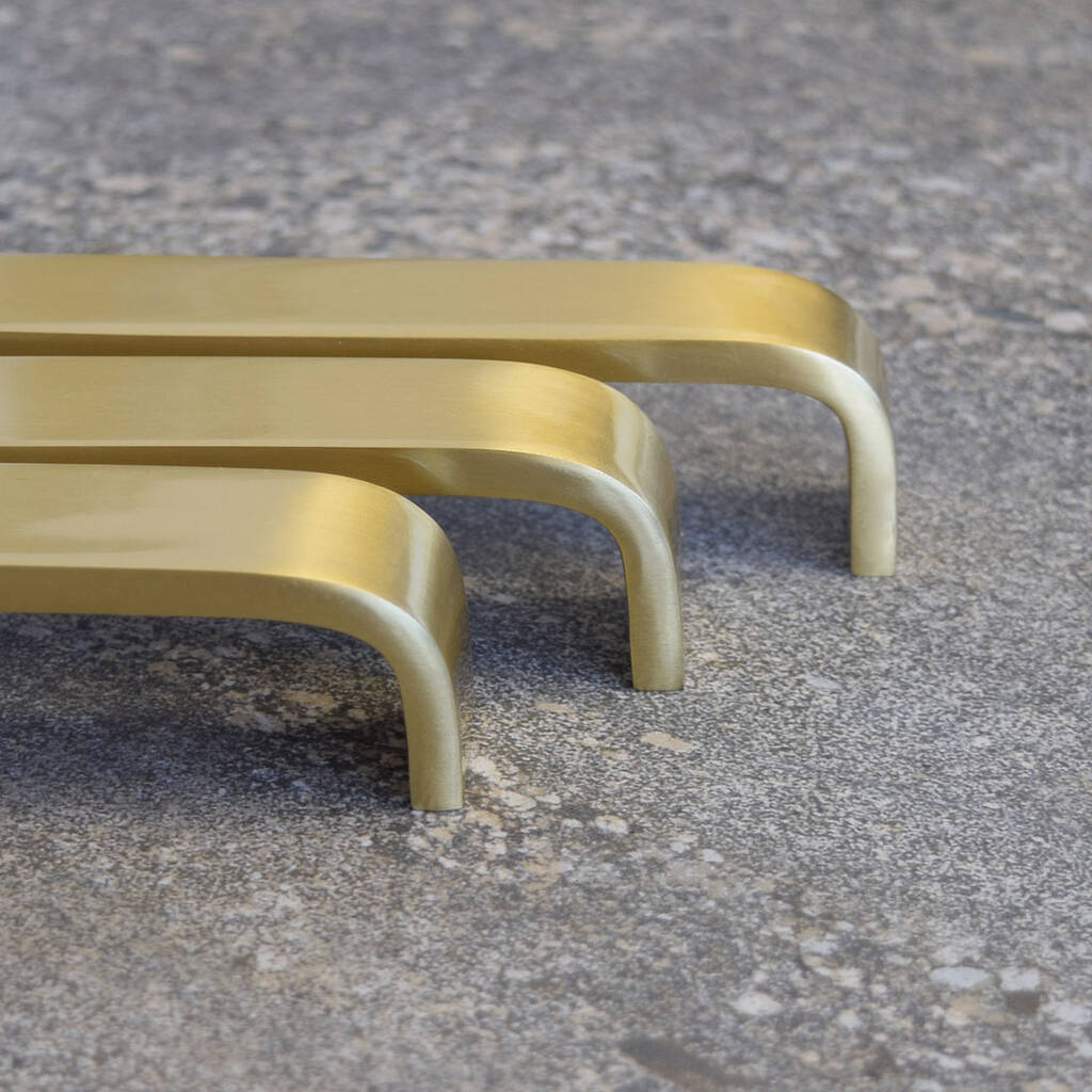 wide curved brass gold door and drawer bar pulls by pushka home