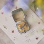 Gold Forget Me Not Bow Huggie Earrings, thumbnail 1 of 11