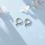 Sterling Silver Extra Tiny Sapphire Blue Huggie Hoop Earrings, thumbnail 1 of 9