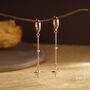 Sterling Silver Dangling Starburst Huggie Hoop Earrings, thumbnail 5 of 11