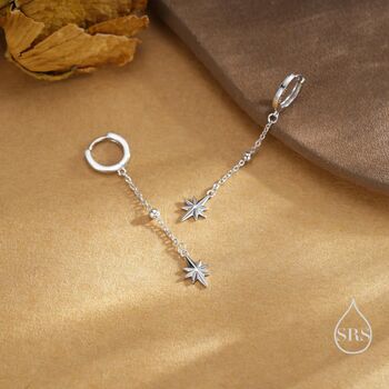 Sterling Silver Dangling Starburst Huggie Hoop Earrings, 2 of 11