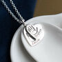 Double Stacked Hand And Footprint Silver Heart Necklace, thumbnail 1 of 8