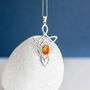 Genuine Baltic Amber Celtic Knot Necklace In Silver, thumbnail 2 of 10