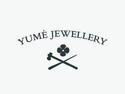 Yumé Jewellery logo, flower and a hammer and a ring making tool crossed 