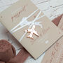 Beige Passport Invitation With Acrylic Plane Charms For Destination Wedding, thumbnail 1 of 10