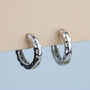 Sterling Silver Geometric Surface Huggie Hoop Earrings, thumbnail 5 of 7