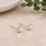 Tiny Star Cut Sterling Silver Round White Opal Stud Earrings, thumbnail 1 of 7