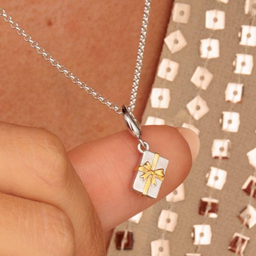 Sterling Silver Christmas Present Charm Necklace With Gold Bow, 1 of 10