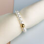 Dainty Pearl Stretch Ring With Sterling Silver Bead, thumbnail 3 of 6