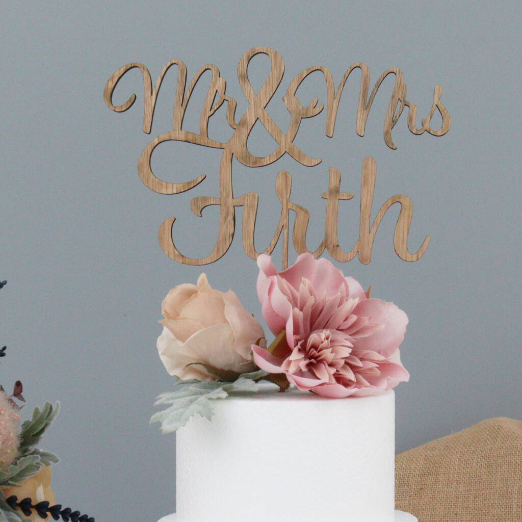 Personalised Wooden Name Wedding Cake Topper, 1 of 9