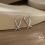 Minimalist Sterling Silver Tusks Hoop Earrings, thumbnail 2 of 11