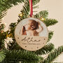 Personalised Baby's First Christmas Wooden Photo Bauble, thumbnail 1 of 3