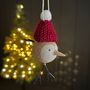 Wooden Bird In Burgundy Pompom Hat Hanging Decoration, thumbnail 1 of 2