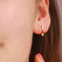 Sterling Silver Star Huggie Earrings, thumbnail 3 of 7