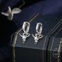 Sterling Silver Tiny Bull Skull Huggie Hoop Earrings, thumbnail 1 of 10