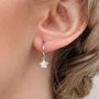 Sterling Silver Mini Hoop And Star Charm Earrings, thumbnail 1 of 5