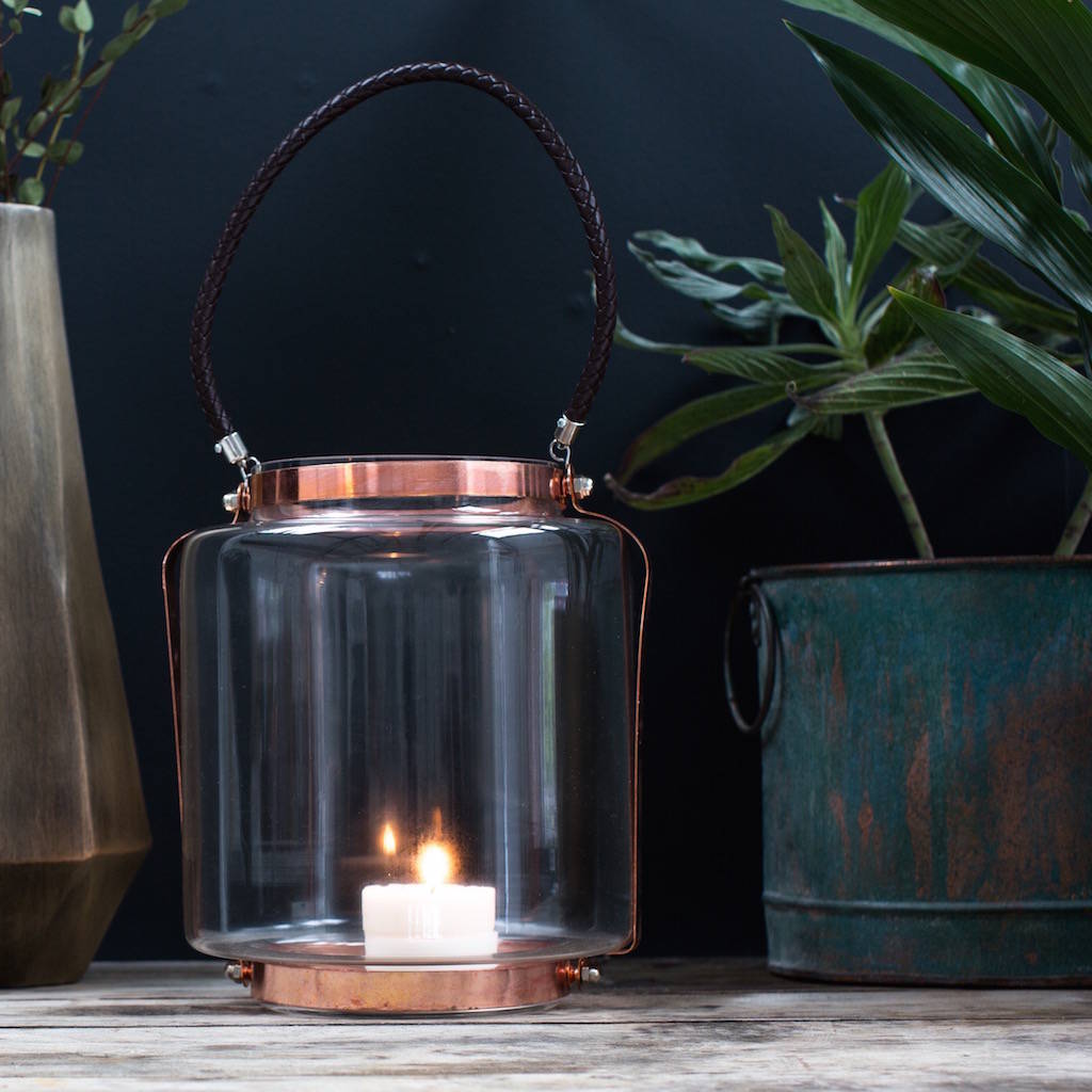 copper and glass lantern with leather rope handle by the forest & co