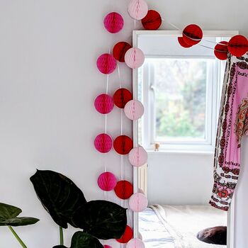 Honeycomb Paper Ball Garland Pinks And Red, 3 of 8