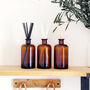 Large Brown Glass Apothecary Diffuser Bottle And Reeds, thumbnail 1 of 9