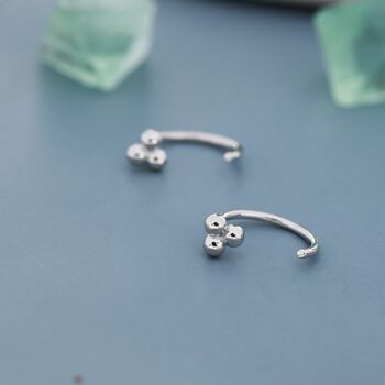 Sterling Silver Tiny Three Ball Huggie Hoop Earrings, 4 of 9