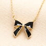 Black Enamel Bow Pendant Necklace In Gold, thumbnail 1 of 3
