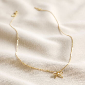 Tiny Pearl Bow Pendant Necklace, 6 of 9